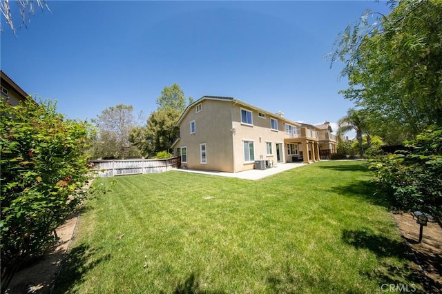 35197 Hogan Dr, Beaumont, CA 92223 - rear view of house with stucco siding, a patio, and central air condition unit