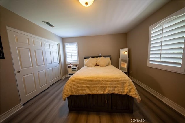 35197 Hogan Dr, Beaumont, CA 92223 - bedroom with dark wood-type flooring, baseboards, and a closet