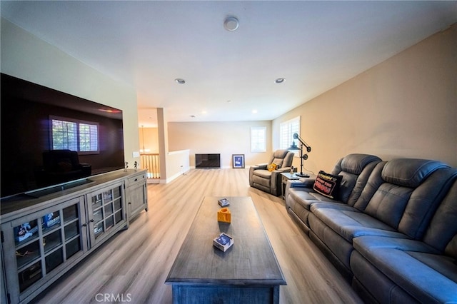 35197 Hogan Dr, Beaumont, CA 92223 - living room featuring light wood-style floors and recessed lighting