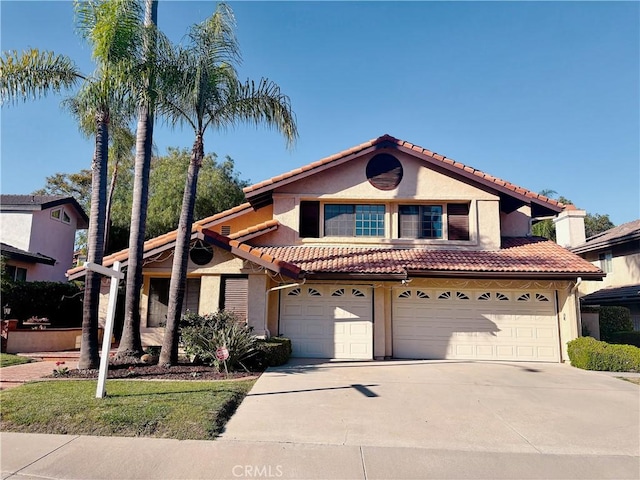 820 Rainwater Ln, Walnut, CA 91789 - view of front of property with driveway, an attached garage, and stucco siding