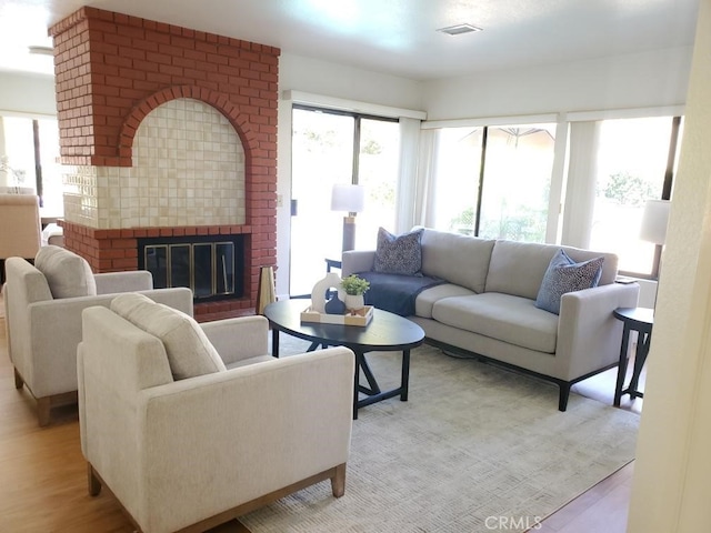 820 Rainwater Ln, Walnut, CA 91789 - living area featuring a brick fireplace and light wood finished floors