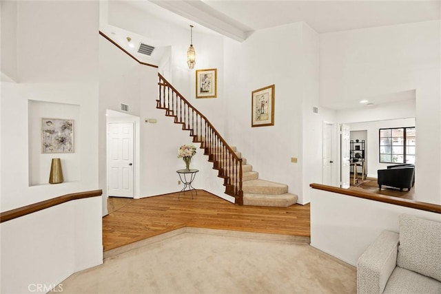 820 Rainwater Ln, Walnut, CA 91789 - staircase with wood finished floors and a towering ceiling