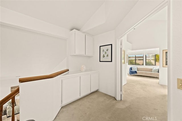 820 Rainwater Ln, Walnut, CA 91789 - corridor with light carpet and an upstairs landing