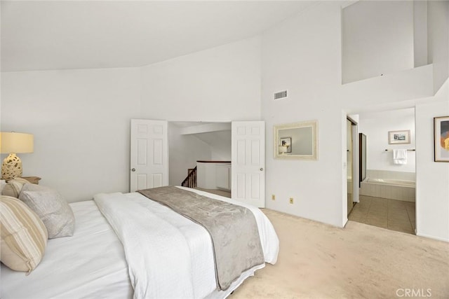820 Rainwater Ln, Walnut, CA 91789 - bedroom with light carpet, high vaulted ceiling, and ensuite bath