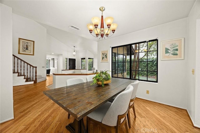 820 Rainwater Ln, Walnut, CA 91789 - dining room with a chandelier, stairs, light wood-style flooring, and baseboards