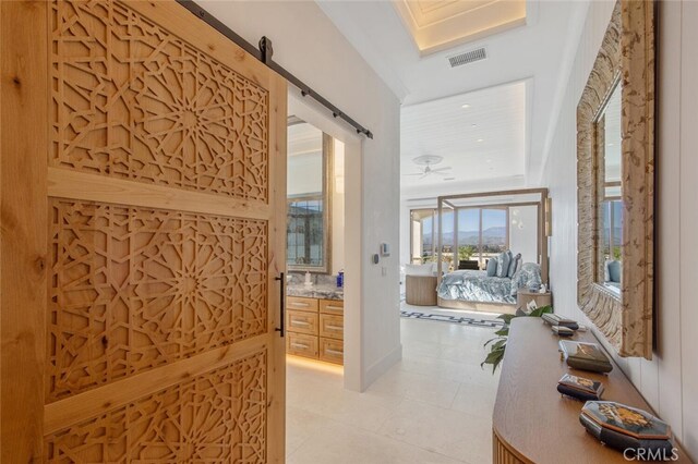 277 Crestview Ave, Camarillo, CA 93010 - hallway with a barn door and light tile patterned floors