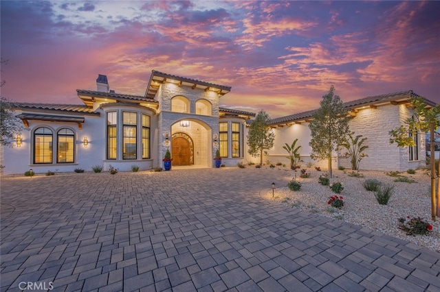 277 Crestview Ave, Camarillo, CA 93010 - mediterranean / spanish home with a chimney, a tiled roof, stucco siding, curved driveway, and stone siding
