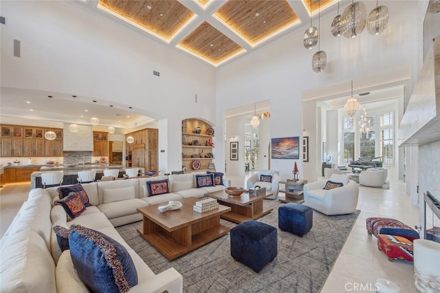 277 Crestview Ave, Camarillo, CA 93010 - living area featuring a towering ceiling, wooden ceiling, a chandelier, light tile patterned floors, and built in shelves