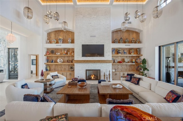 277 Crestview Ave, Camarillo, CA 93010 - living area with a towering ceiling, built in shelves, and a fireplace