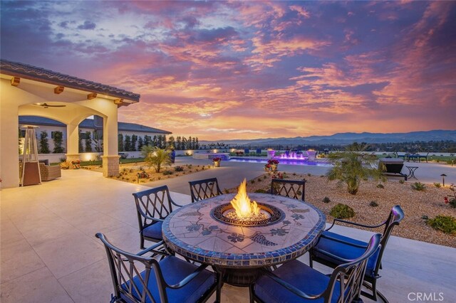 277 Crestview Ave, Camarillo, CA 93010 - view of patio featuring a fire pit, outdoor dining space, and a ceiling fan