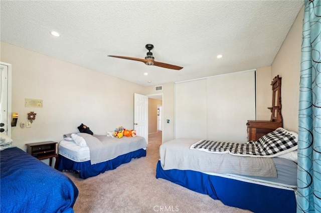 1824 S Starfire Ave, Corona, CA 92879 - carpeted bedroom featuring a closet, recessed lighting, a ceiling fan, and a textured ceiling