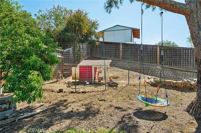 1824 S Starfire Ave, Corona, CA 92879 - view of yard featuring exterior structure, an outbuilding, and fence