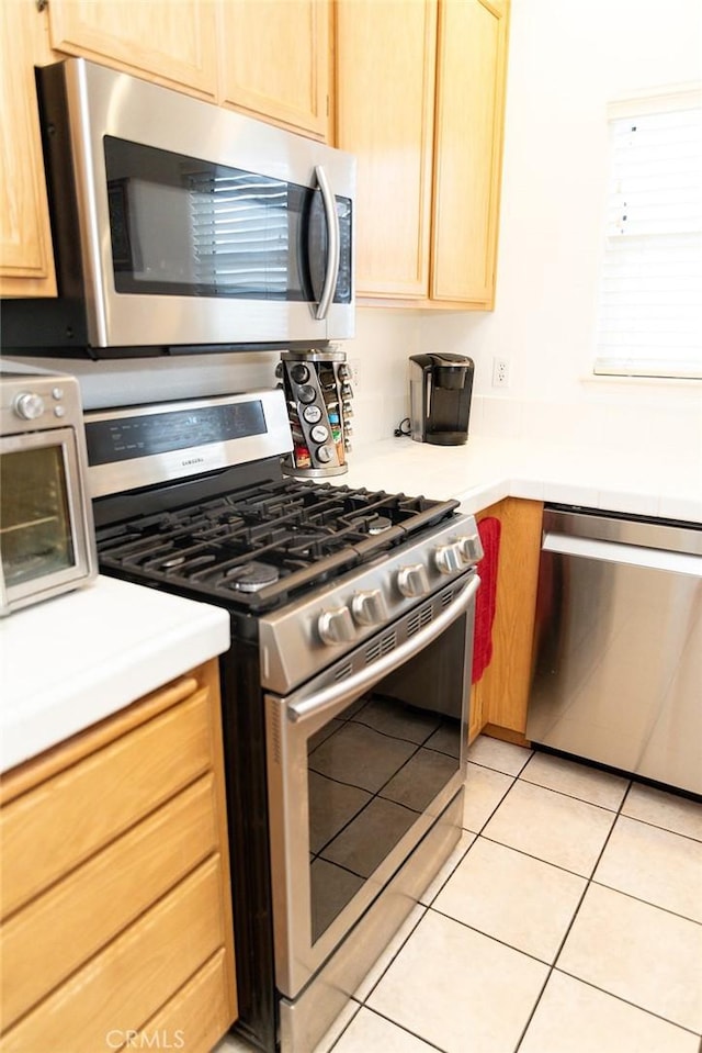 564 Margie Pl, Nipomo, CA 93444 - kitchen featuring stainless steel appliances, light countertops, light brown cabinetry, and light tile patterned flooring