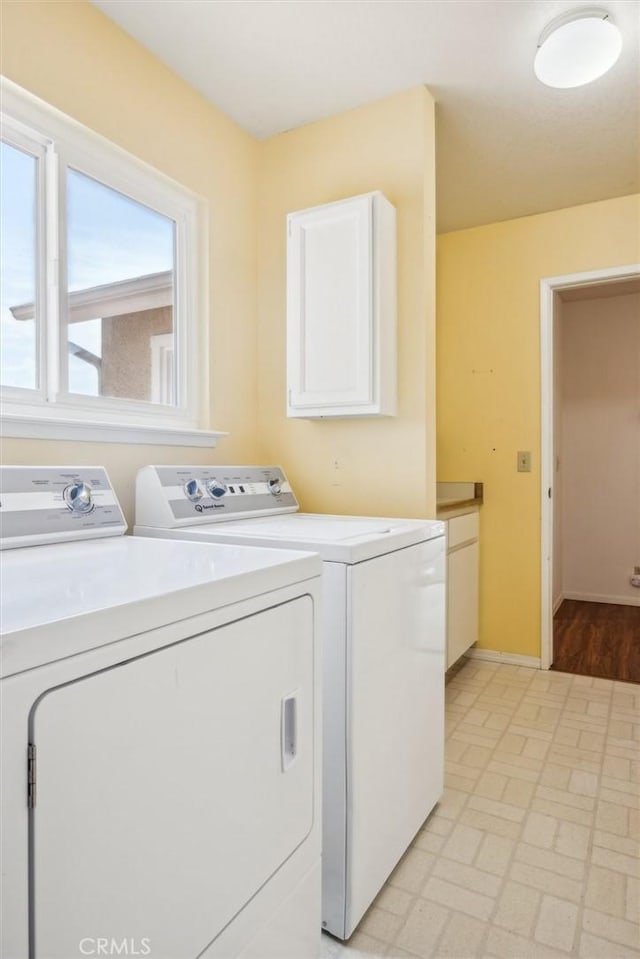 855 Dahlia Ln, San Luis Obispo, CA 93401 - washroom with washer and clothes dryer, cabinet space, and baseboards