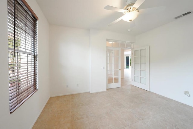 23425 Mountain Peak Rd, Ramona, CA 92065 - empty room featuring french doors, light tile patterned flooring, ceiling fan, and baseboards