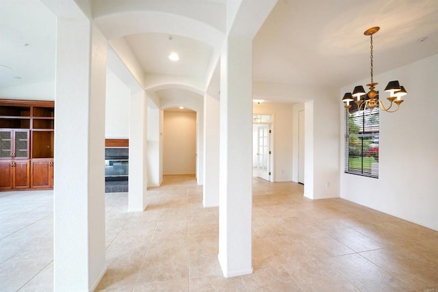 23425 Mountain Peak Rd, Ramona, CA 92065 - spare room featuring arched walkways, light tile patterned flooring, a chandelier, and recessed lighting