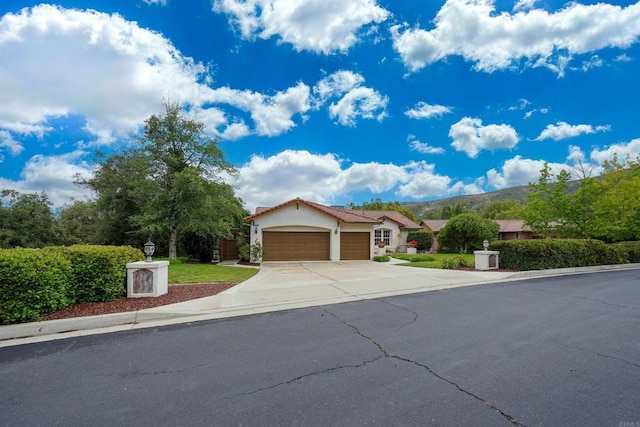 23425 Mountain Peak Rd, Ramona, CA 92065 - view of front of home featuring an attached garage, driveway, and stucco siding