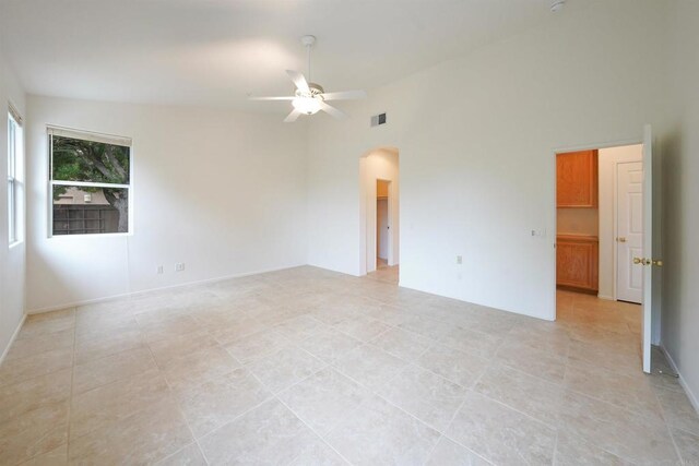 23425 Mountain Peak Rd, Ramona, CA 92065 - spare room featuring a ceiling fan, arched walkways, light tile patterned floors, and lofted ceiling