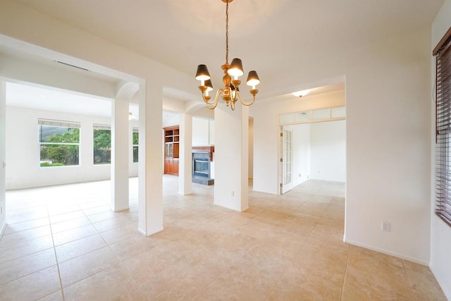 23425 Mountain Peak Rd, Ramona, CA 92065 - empty room featuring light tile patterned floors, a chandelier, and baseboards