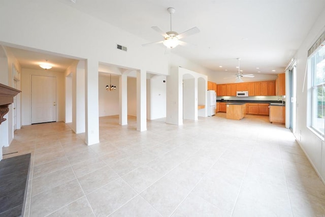 23425 Mountain Peak Rd, Ramona, CA 92065 - unfurnished living room with ceiling fan, light tile patterned floors, healthy amount of natural light, a chandelier, and recessed lighting