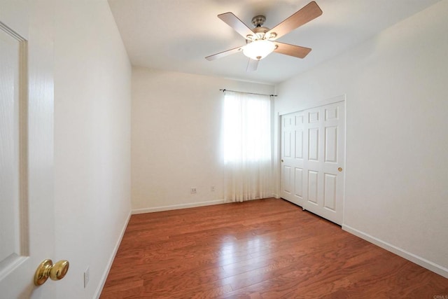 23425 Mountain Peak Rd, Ramona, CA 92065 - unfurnished bedroom featuring wood finished floors, baseboards, ceiling fan, and a closet