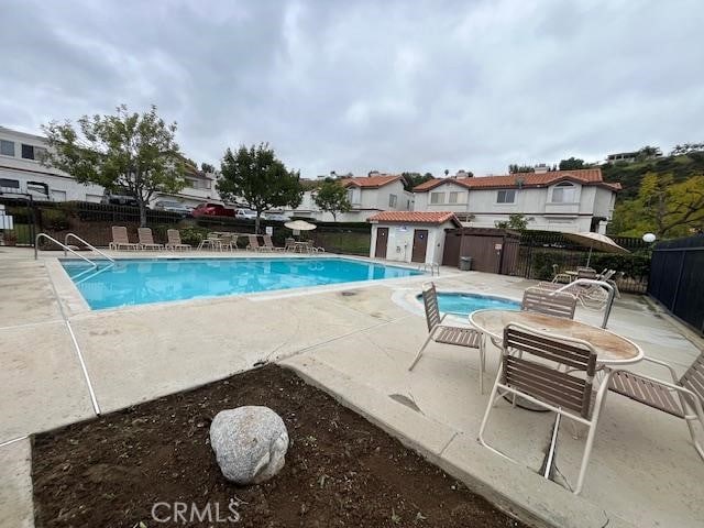 24222 Sylvan Glen Rd Unit F, Diamond Bar, CA 91765 - community pool featuring fence and a patio area