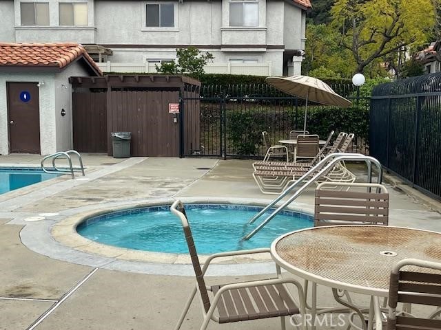 24222 Sylvan Glen Rd Unit F, Diamond Bar, CA 91765 - community pool with fence and a patio