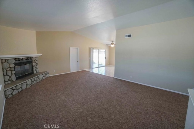 11540 Mohawk Rd, Apple Valley, CA 92308 - unfurnished living room with carpet, a stone fireplace, lofted ceiling, ceiling fan, and baseboards