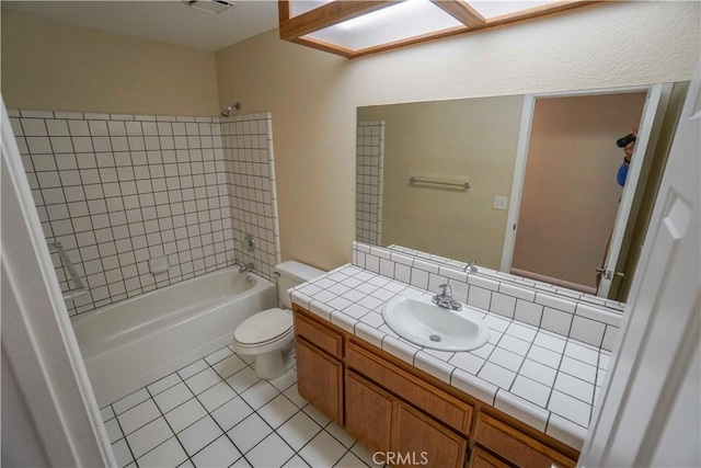 11540 Mohawk Rd, Apple Valley, CA 92308 - bathroom featuring tile patterned floors, toilet, shower / tub combination, and vanity