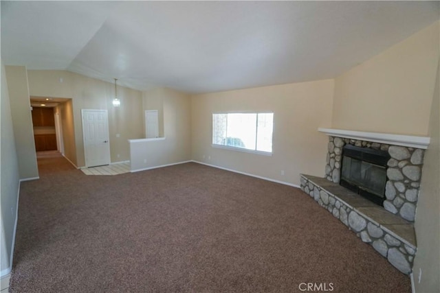 11540 Mohawk Rd, Apple Valley, CA 92308 - unfurnished living room with lofted ceiling, baseboards, carpet floors, and a fireplace