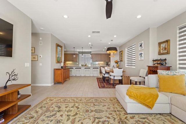 6132 Colt Pl Unit 101, Carlsbad, CA 92009 - living area with light wood finished floors, recessed lighting, and ceiling fan