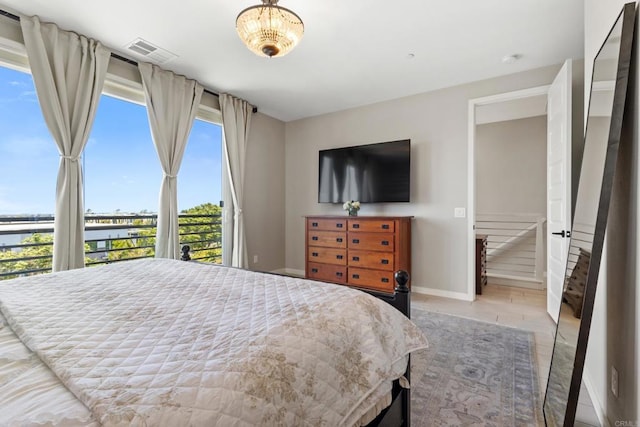 6132 Colt Pl Unit 101, Carlsbad, CA 92009 - bedroom featuring light wood-style flooring and a water view