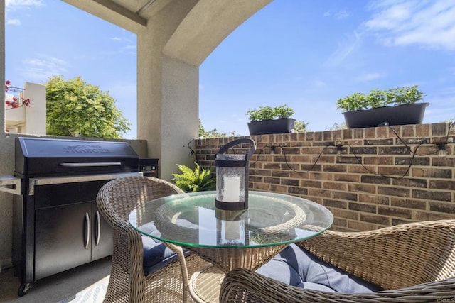 6132 Colt Pl Unit 101, Carlsbad, CA 92009 - balcony with outdoor dining space and a grill