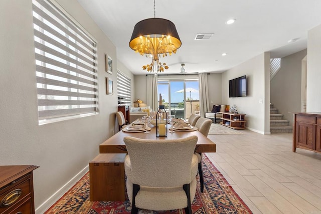 6132 Colt Pl Unit 101, Carlsbad, CA 92009 - dining space with a chandelier, stairs, and recessed lighting
