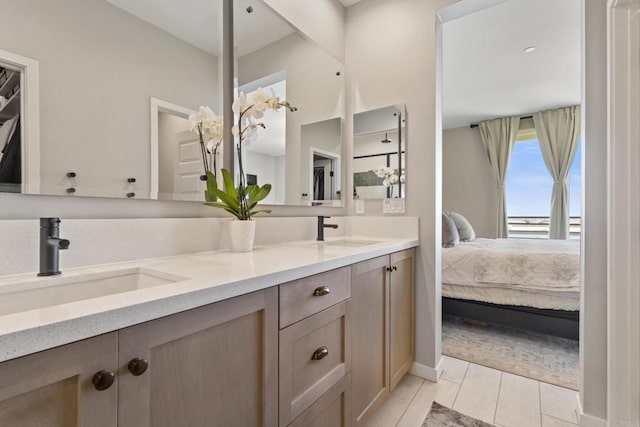 6132 Colt Pl Unit 101, Carlsbad, CA 92009 - ensuite bathroom with double vanity and tile patterned flooring