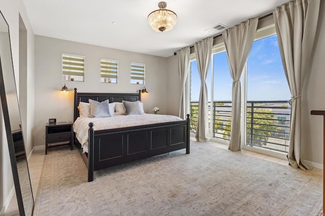 6132 Colt Pl Unit 101, Carlsbad, CA 92009 - bedroom with multiple windows and light carpet