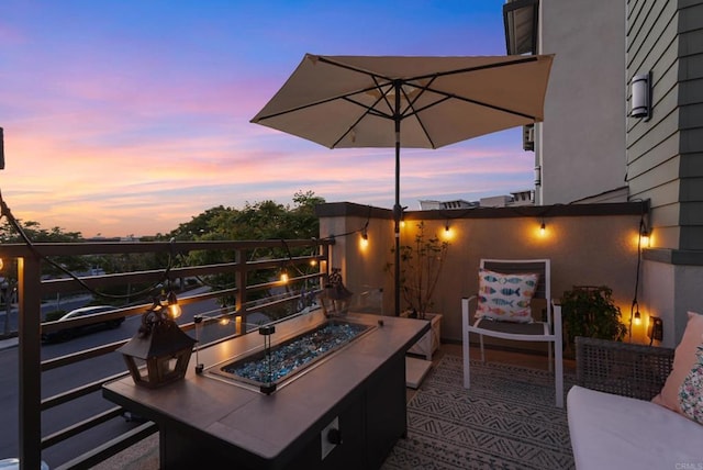 6132 Colt Pl Unit 101, Carlsbad, CA 92009 - patio terrace at dusk with a fire pit
