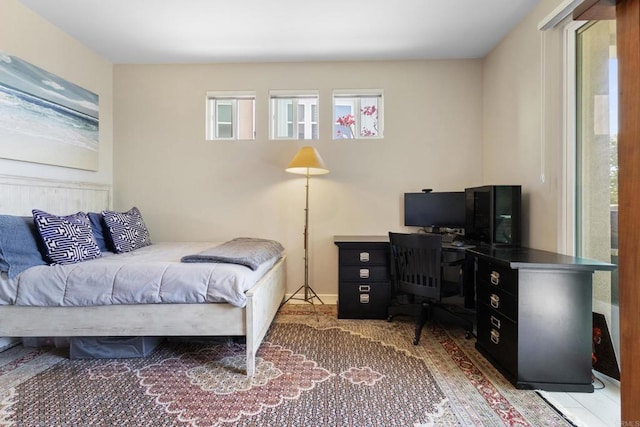 6132 Colt Pl Unit 101, Carlsbad, CA 92009 - bedroom featuring multiple windows and a desk