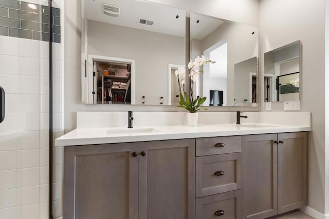 6132 Colt Pl Unit 101, Carlsbad, CA 92009 - full bathroom with double vanity and a walk in closet