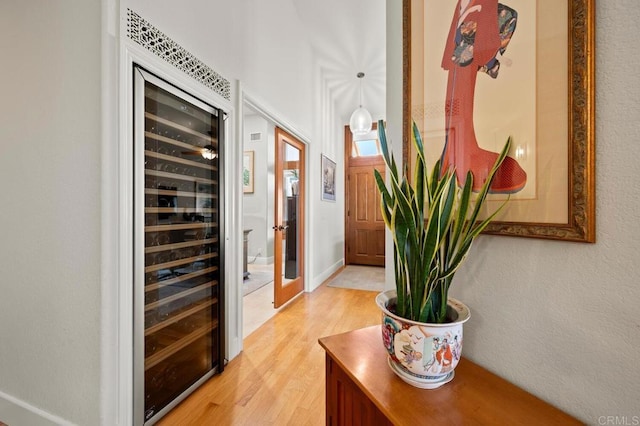 1850 Willowhaven Rd, Encinitas, CA 92024 - corridor featuring light wood-style floors and wine cooler