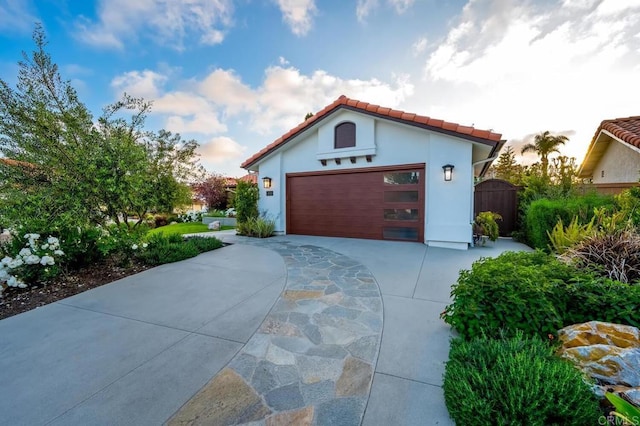 1850 Willowhaven Rd, Encinitas, CA 92024 - mediterranean / spanish-style house featuring concrete driveway, a tile roof, stucco siding, and a gate