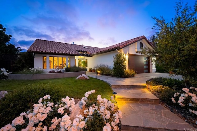 1850 Willowhaven Rd, Encinitas, CA 92024 - mediterranean / spanish home with a tile roof, an attached garage, concrete driveway, a lawn, and stucco siding