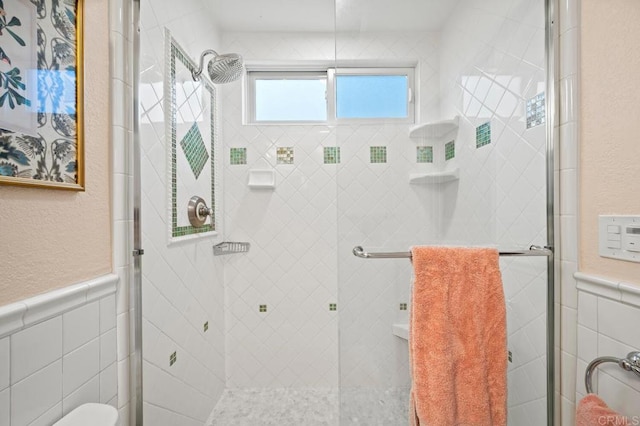 1850 Willowhaven Rd, Encinitas, CA 92024 - bathroom with a shower stall, tile walls, wainscoting, and a textured wall