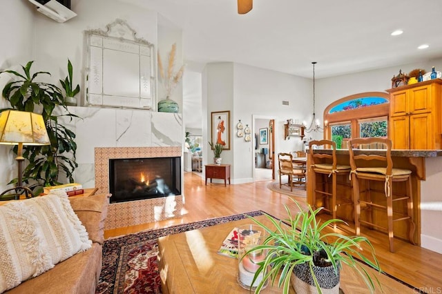1850 Willowhaven Rd, Encinitas, CA 92024 - living area featuring light wood finished floors, recessed lighting, a chandelier, and a fireplace