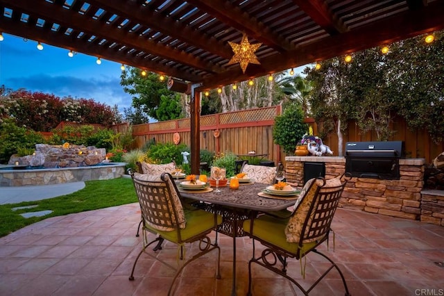 1850 Willowhaven Rd, Encinitas, CA 92024 - patio terrace at dusk with a fenced backyard, area for grilling, a patio area, outdoor dining space, and a pergola