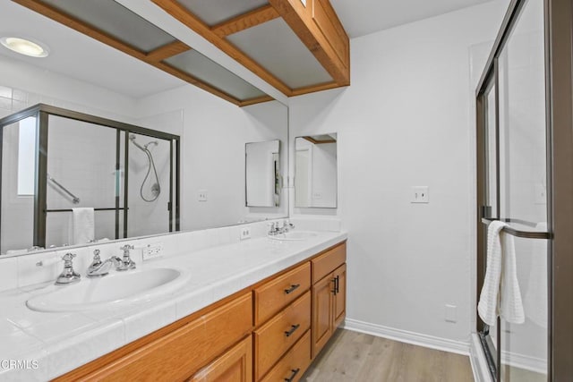 5131 Greenbush Ave, Sherman Oaks, CA 91423 - full bathroom with double vanity, a stall shower, and wood finished floors