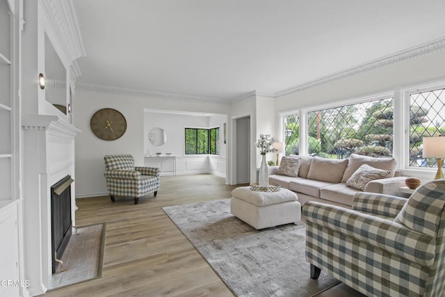 5131 Greenbush Ave, Sherman Oaks, CA 91423 - living room with a fireplace with flush hearth, ornamental molding, and light wood-style flooring
