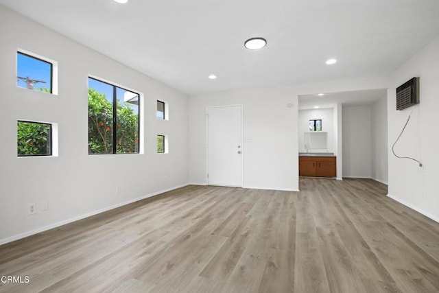5131 Greenbush Ave, Sherman Oaks, CA 91423 - unfurnished living room with recessed lighting and light wood-style floors