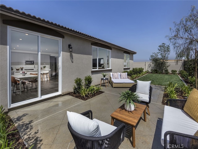 35203 Lopez Ln, Beaumont, CA 92223 - fenced backyard with a patio and outdoor lounge area