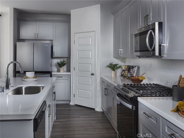 35203 Lopez Ln, Beaumont, CA 92223 - kitchen featuring appliances with stainless steel finishes, a sink, gray cabinetry, and light countertops